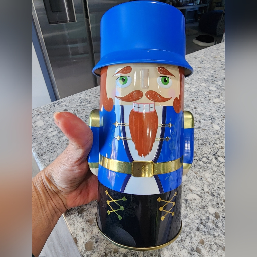 Harry London Tin Toy Soldier Nutcracker blue Christmas container, 9", vintage